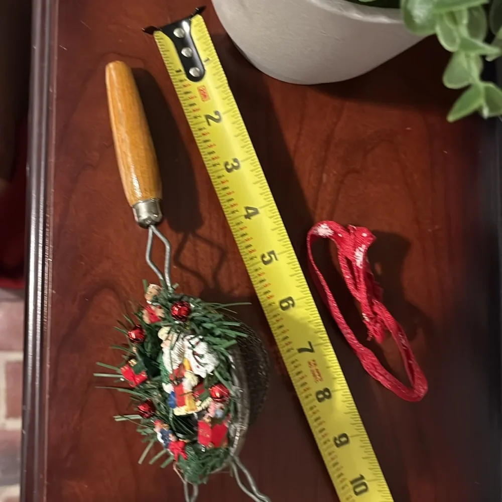 Handmade Santa Holiday Wreath on an old tea strainer.